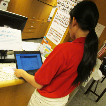 A volunteer helps with MyChart. 