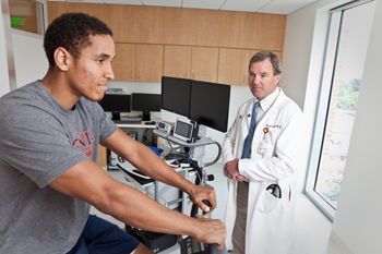 Sports cardiologist Robert Battle, MD, and Virginia Cavaliers basketball player Malcolm Brogdon