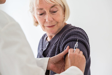 Woman receiving shingles vaccine