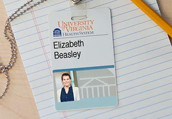 The badge of Elizabeth Beasley, UVA Health System community relations lead.