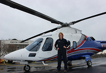 standing in front of medical helicopter