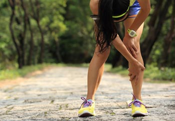 runner with severe leg cramps