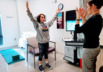 Way shows Josephine how to breathe to ease anxiety.