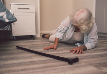 older woman who fell down on the floor