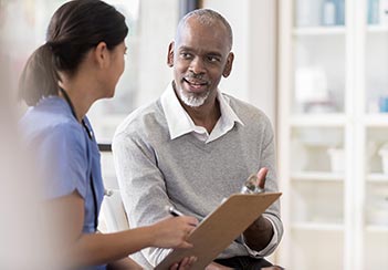 man consulting with a nurse