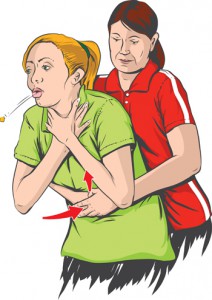 Woman performing the Heimlich maneuver to help chocking woman