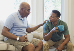 men talking over coffee