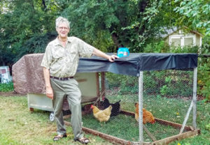 Norm feeding his beloved chickens