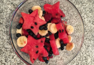 Star-Spangled Fruit Salad with blue berries, bananas, and star watermelon