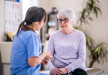 A distressed older lady meets with her doctor