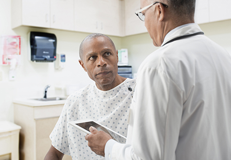 Doctor comforting patient in office