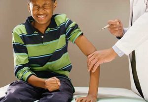 A boy getting an HPV vaccine shot