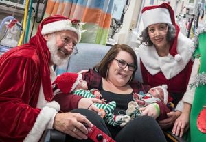 Cochlear implant recipient Blaze and his twin Gunner with mother Stephanie in the UVA NICU at Christmas