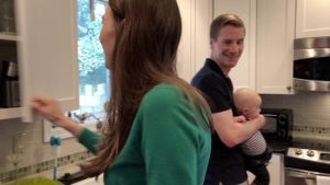 Matt Miller with his wife and child in their kitchen