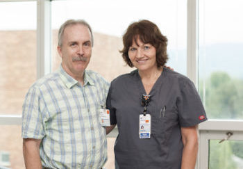 Trauma survivor Pete Weatherly stands with trauma nurse