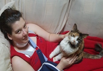 Michelle Caron, Inspire device patient, with her cat 1 day post surgery