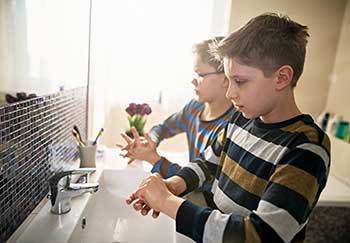 Kids washing their hands feel in control - one way to keep calm about coronavirus.