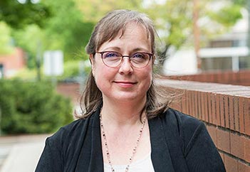 lab specialist Dawn Dirks standing outside