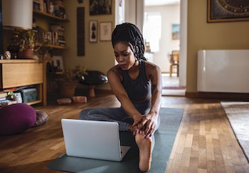 woman doing yoga at home