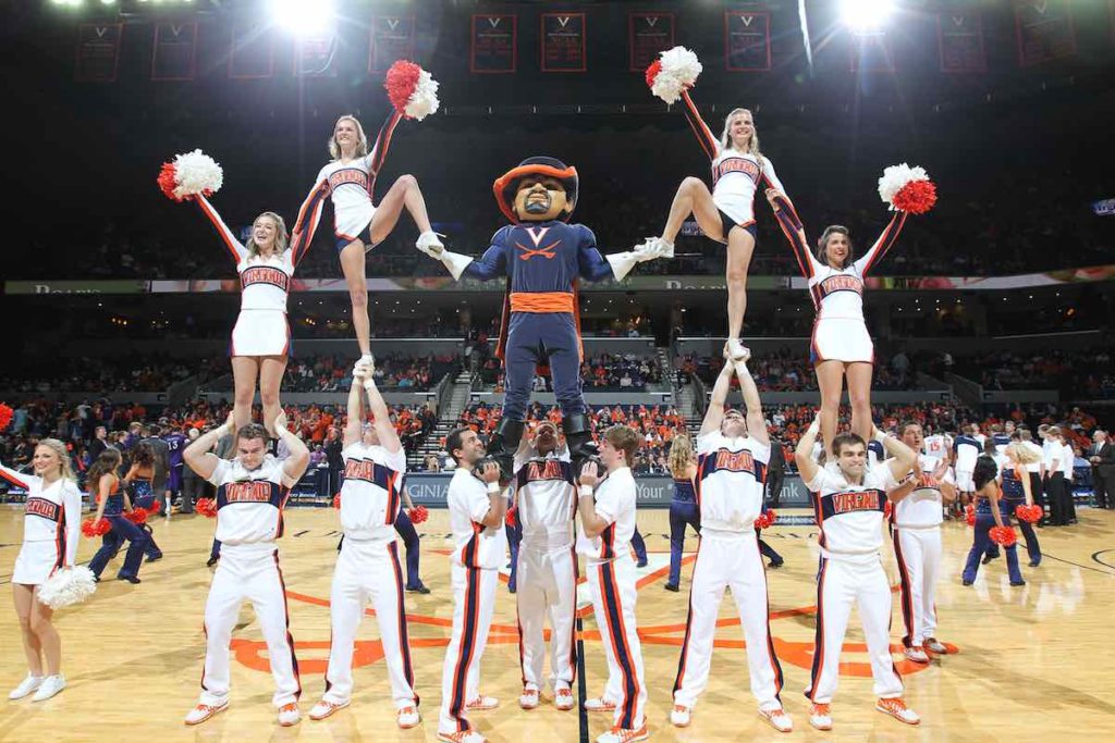 UVA Cheerleader team at a basketball game