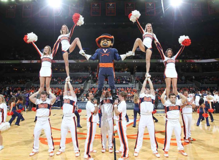 UVA Cheerleader team at a basketball game