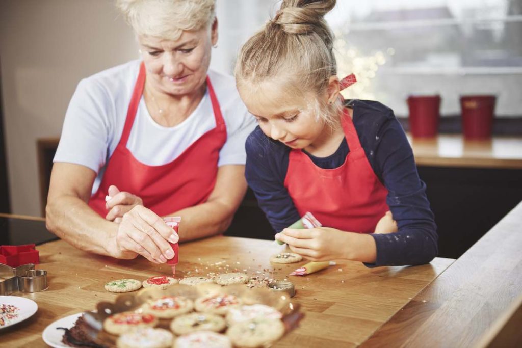 grandma making cookies with granddaughter