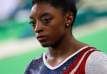 Gymnast Simone Biles wearing red, white and blue leotard