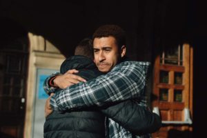 two men hugging to support depression
