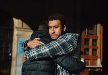 two men hugging to support depression