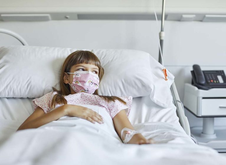 sick girl in hospital bed