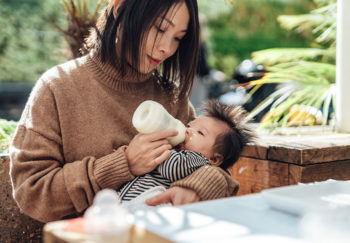 A mother feeds her baby during the baby formula shortage