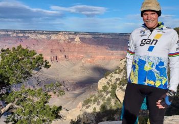 Bob Wright poses next to the Grand Canyon