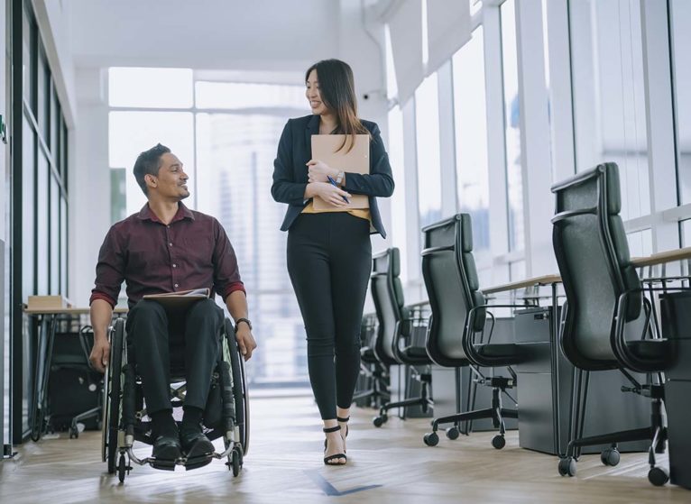 Man in wheelchair with coworker