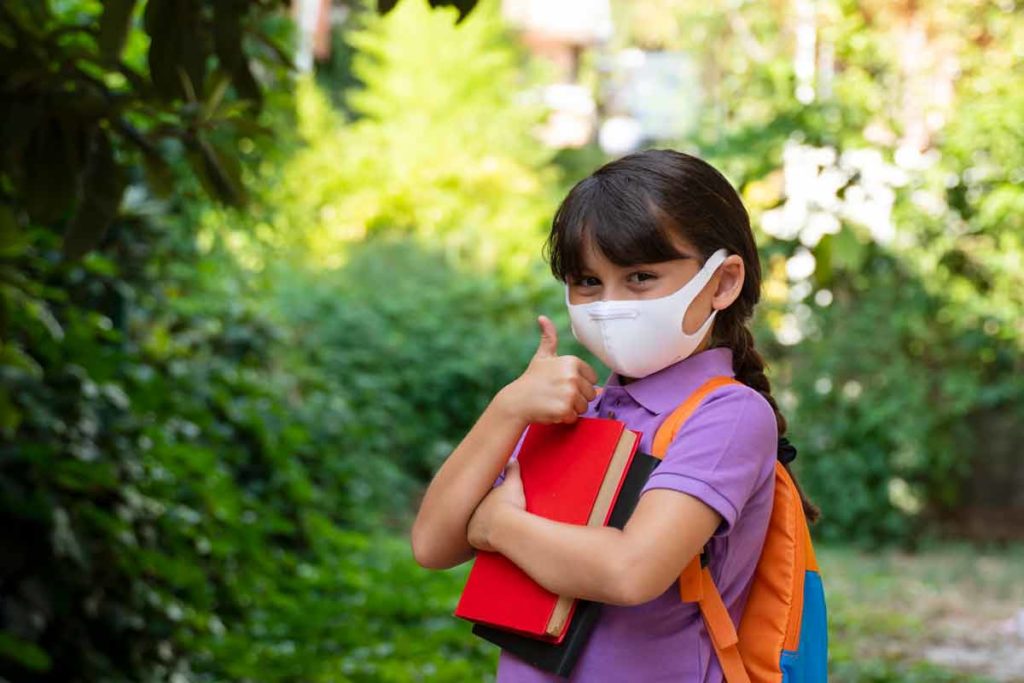 Girl wearing mask to school