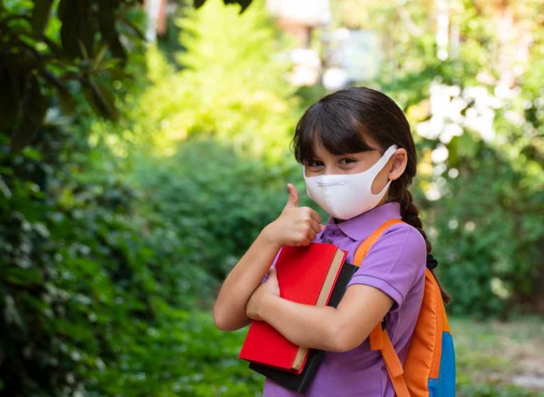 Girl wearing mask to school