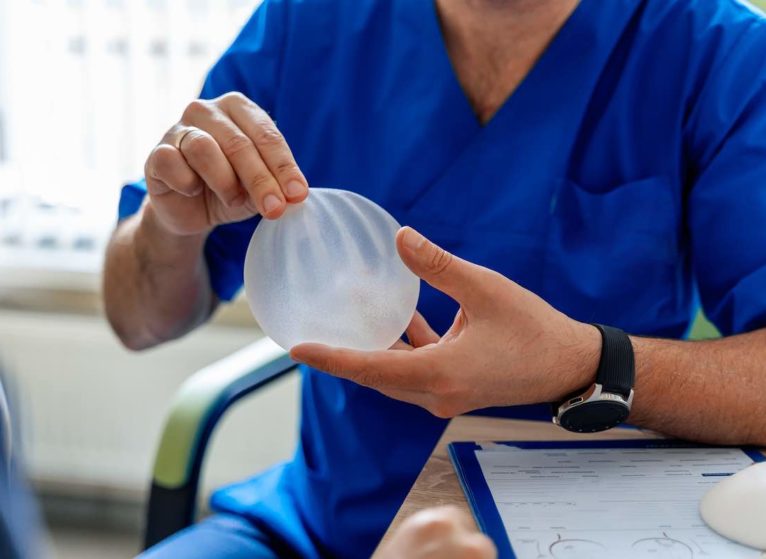 doctor shares signs of breast implant problems