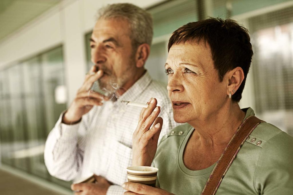 two people smoking