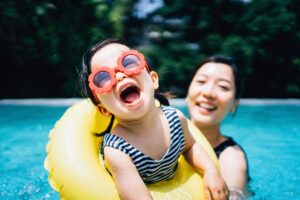 toddler and mom in pool