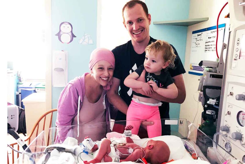 Dana's family in the NICU after she gave birth while going through cancer treatment.