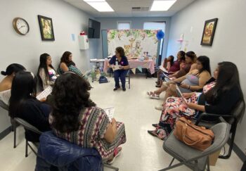 Women sitting in a circle at a baby shower