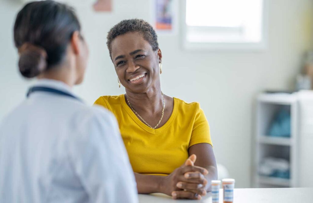 Black woman meeting with a healthcare provider