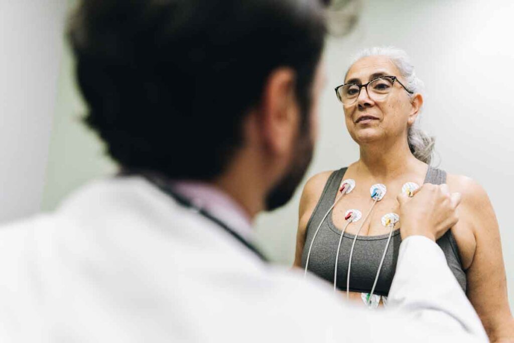 A doctor checking a patient during a heart exam for a clinical trial