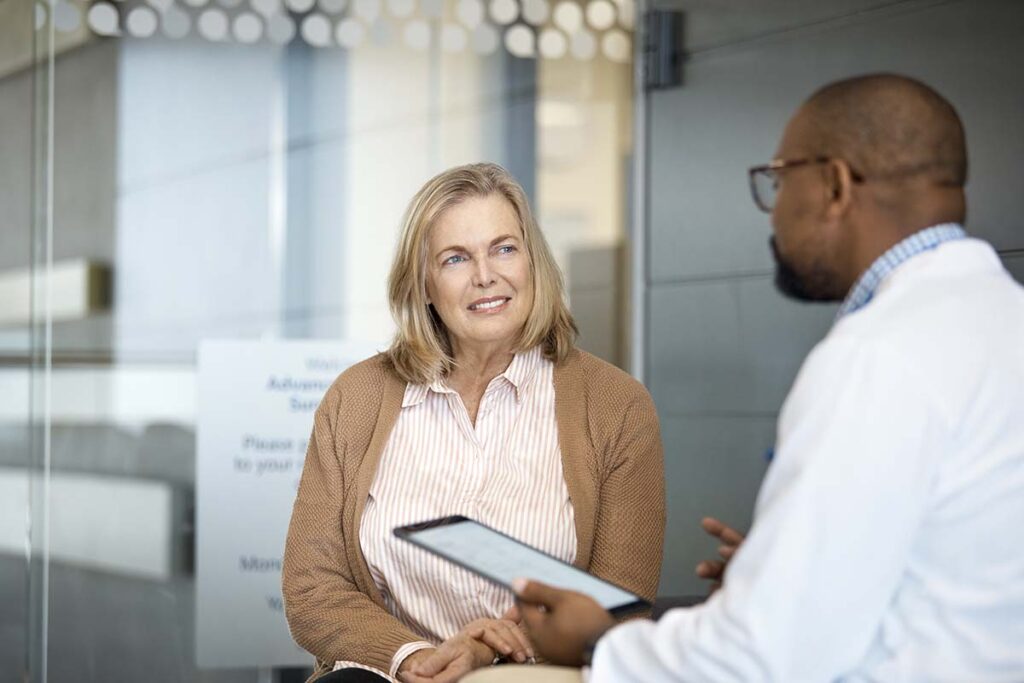 Woman talking with doctor