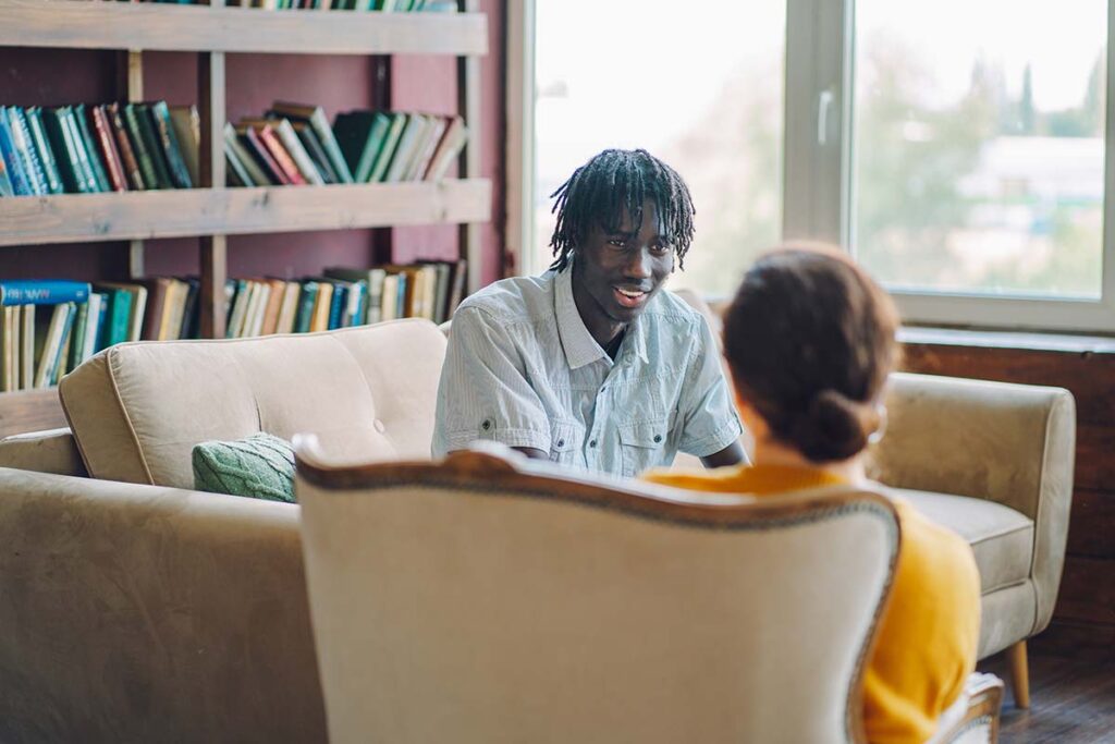 A patient and provider discussing neurogenetics and genetic counseling appointment