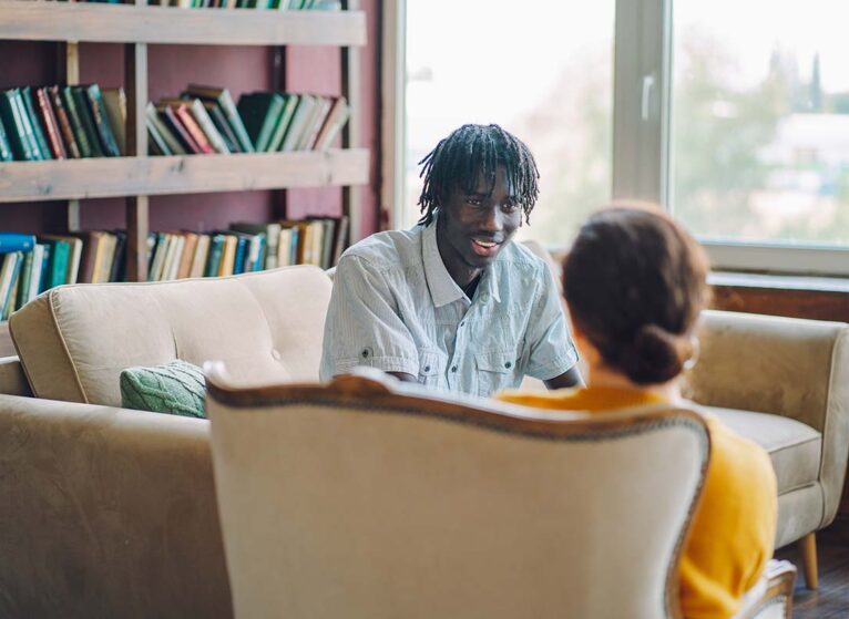 A patient and provider discussing neurogenetics and genetic counseling appointment