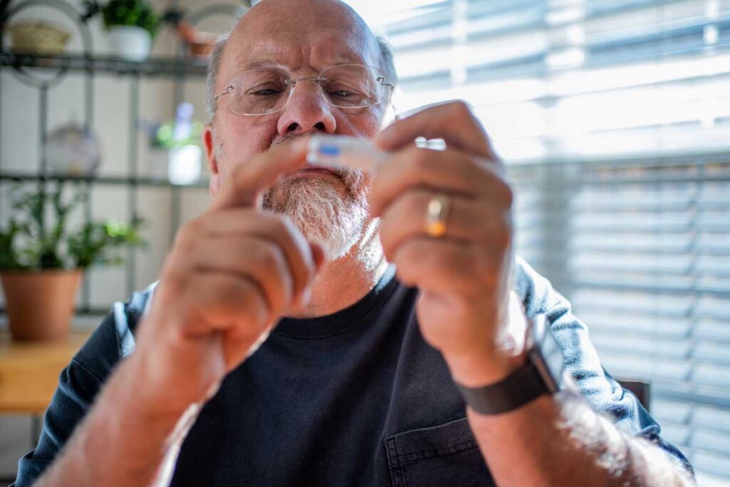 Man checking his blood sugar