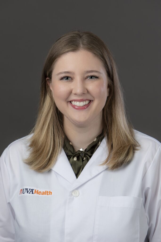 Headshot of Dr. Morrissey smiling in a white UVA Health branded coat