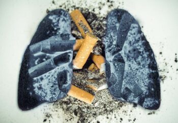 image of charred lungs overlayed on an ash tray with cigarettes