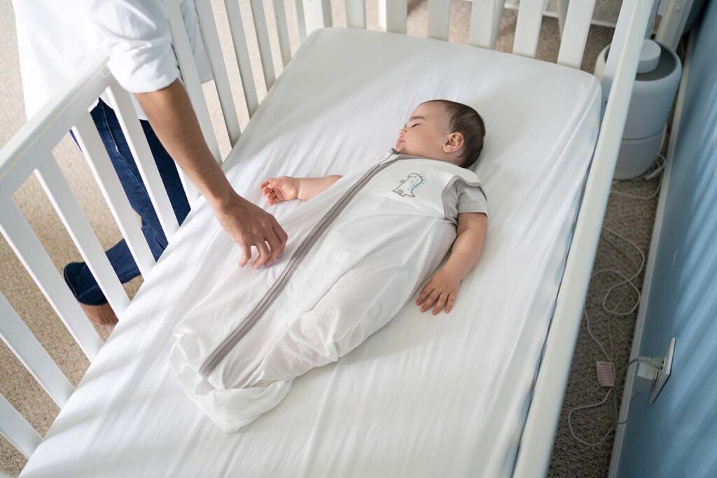 Baby sleeping in sleep sack safely