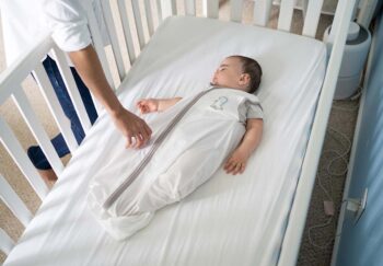 Baby sleeping in sleep sack safely